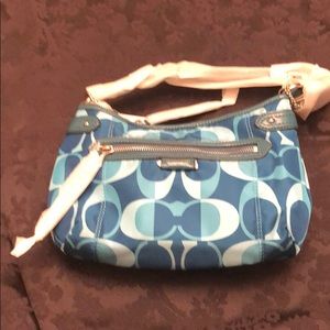 Teal Coach cross-body sports bag.